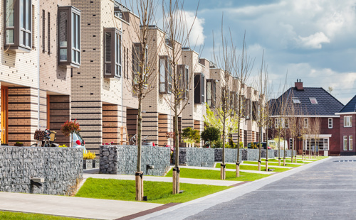 This slide displays Row of contemporary family houses in the Dutch city of Zutphen By Martin Bergsma Adobestock 394665786.