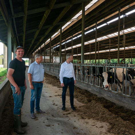 This slide displays steward and farmer in cowshed.
